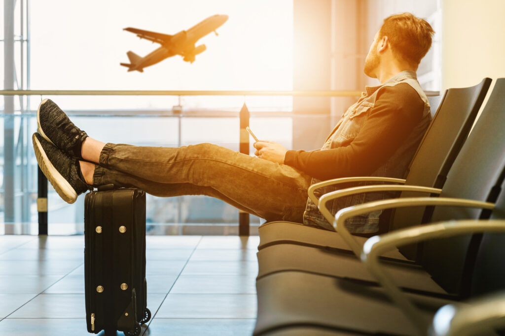 Man sitting in the airport after being bussed there